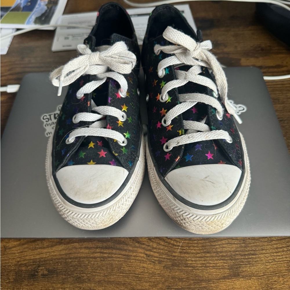 Girls size 4 converse. Lightly worn. Would look new with new laces